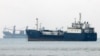 Vessels transit the Hormuz Strait off the coast of Iran's southern port city of Bandar Abbas on September 7.