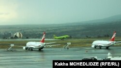 Georgia -- Georgian and Russian passenger jets at Tbilisi international airport.