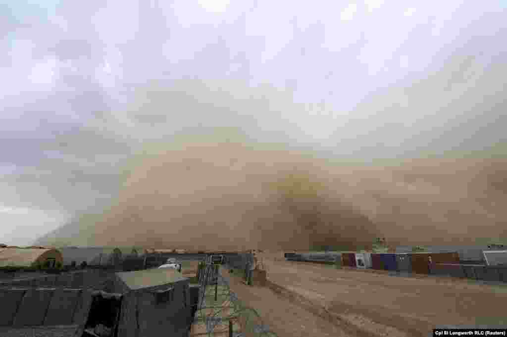 A sandstorm approaches the camp of British forces in Helmand Province, Afghanistan, on June 3.