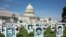 Activists opposing the government of Iran place the images of victims of state-sponsored executions of political prisoners in 1988 in Iran, on the East Front of the US Capitol in Washington, September 12, 2019