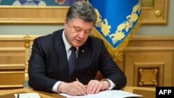 Ukrainian President Petro Poroshenko signed the new legislation into law on September 25. (illustrative photo)