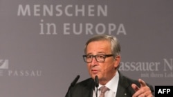 European Commission chief Jean-Claude Juncker speaks during a press conference on October 8 at the border town of Passau, Germany.