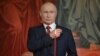 Russian President Vladimir Putin makes the sign of the cross during a Mass earlier this year at Moscow's Cathedral of Christ the Savior.