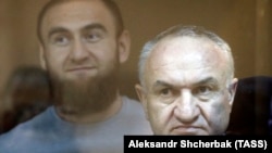 Raul Arashukov (front) and his son Rauf attend a court hearing in Moscow in July 2020.