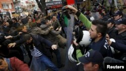 Turkish police use a tear-inducing agent against demonstrators during a protest over the arrest of two reporters in Ankara late last year. Turkish President Recep Tayyip Erdogan was singled out in the Freedom House report for his crackdown on journalists.