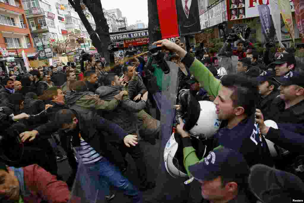 Police use tear-inducing agent against demonstrators during a protest over the arrest of journalists Can Dundar and Erdem Gul in Ankara, Turkey, on November 27. (Reuters/Umit Bektas )