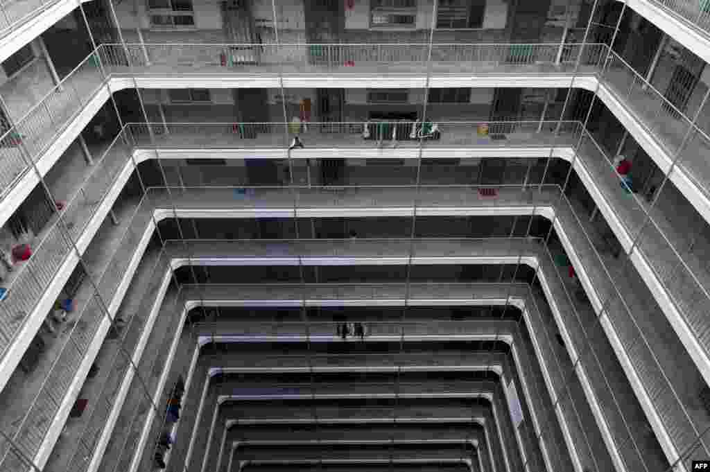 Laundry dries on the railings in a Kowloon government housing estate in Hong Kong. (AFP/Anthony Wallace)