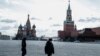 Russia -- Russian police officers patrol on the nearly-deserted Red Square in Moscow, April 6, 2020