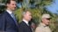 Syrian President Bashar al-Assad (left), Russian President Vladimir Putin (center), and Russian Defense Minister Sergei Shoigu visit the Hmeimim military base in Latakia Province on December 11.