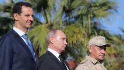 Кутилмаганда Сурияга борган Путин рус ҳарбийларини Россияга қайтаришга кўрсатма берди