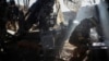 (file photo) Ukrainian servicemen fire a howitzer towards Russian troops in the Donetsk region.