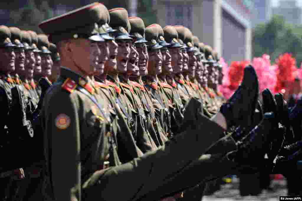 North Korean soldiers march during a mass rally on Kim Il Sung Square in Pyongyang on September 9. (AFP/Ed Jones)