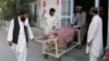 Relatives move a boy who was injured during border clashes between Pakistani and Afghan forces at a hospital in Chaman on May 5. 