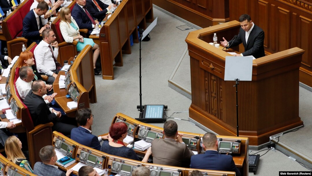 Ukrainian President Volodymyr Zelenskiy addresses parliament in Kyiv on August 29, announcing the country's new government.