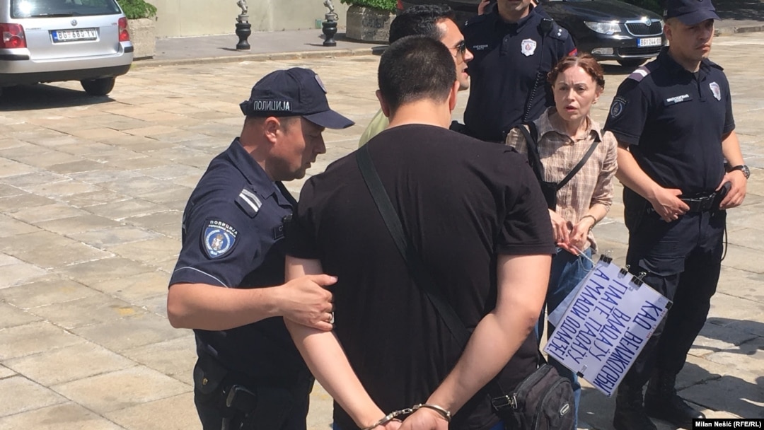 Serbian police arrested two participants in a May Day protest who they say verbally attacked Labor Minister Zoran Djordjevic.