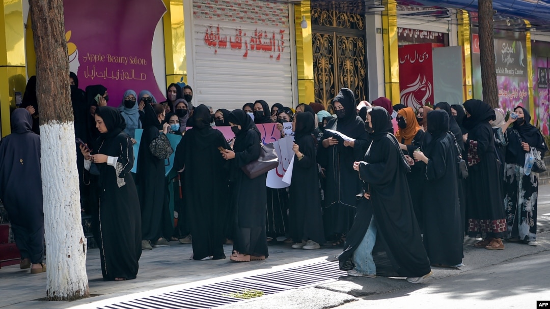Afghan women stage a protest for their rights at a beauty salon in the Shahr-e Naw area of Kabul on July 19.