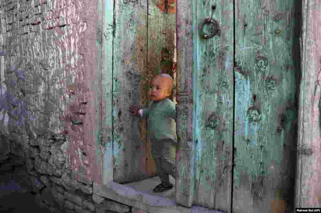 An Afghan girl stands in the doorway of her home in Kabul. (AP/Rahmat Gul)