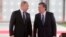 Russian President Vladimir Putin (left) and his Uzbek counterpart, Shavkat Mirziyoev, attend a welcoming ceremony in Tashkent on October 19.