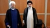 Former Iranian President Hassan Rohani (left) stands with Iran's new president, Ebrahim Raisi, during Raisi's inauguration ceremony in Tehran on August 3.