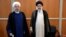 Former Iranian President Hassan Rohani (left) stands with Iran's new president, Ebrahim Raisi, during Raisi's inauguration ceremony in Tehran on August 3.