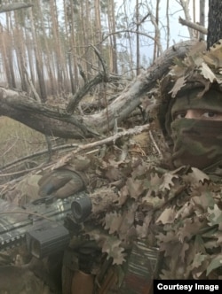 Bruce in the same camouflage outfit worn in the video of a Russian position being captured