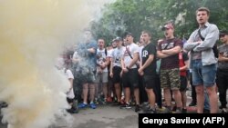 People gather for a protest in front of the Interior Ministry in Kyiv after a 5-year-old boy was fatally shot by two police officers.