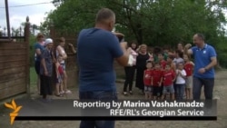 In Georgian Reunion, Two Families' Lives Come Full Circle