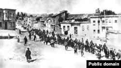 Armenians are marched to a nearby prison in Mezireh by armed Turkish soldiers in Kharpert in the Ottoman Empire in April 1915.