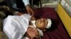 A man injured in a blast in Orakzai lies at a hospital bed after he was brought for treatment in Peshawar on November 23.