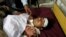 A man injured in a blast in Orakzai lies at a hospital bed after he was brought for treatment in Peshawar on November 23.