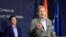 SERBIA -- EU  Enlargement Commissioner Johannes Hahn (R) gestures during a joint press conference with Serbian Prime Minister Ana Brnabic in Belgrade, July 26, 2019