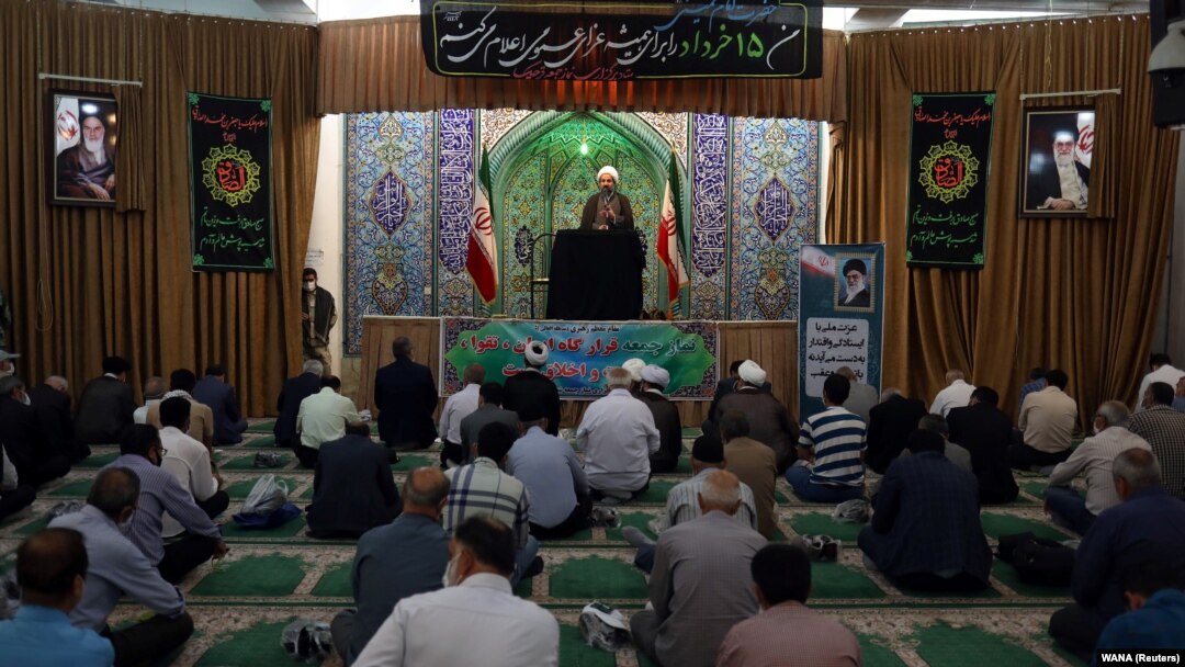 Iranian worshippers attend the Friday Prayers while maintaining social distancing in Tehran Province on June 12.