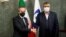 According to the International Atomic Energy Agency, the agreement was reached on December 15 by IAEA Director-General Rafael Mariano Grossi (left) and the head of Iran's nuclear energy agency Mohammad Eslami. (file photo) 