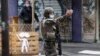 A French soldier attends the scene of a knife attack near the former offices of satirical newspaper Charlie Hebdo in Paris on September 25.