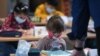 Second-grade pupils wear face masks as they attend school lessons at the Petri primary school in Dortmund,Germany , on February 22, 2021