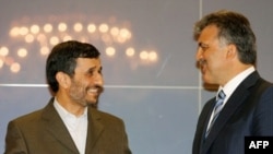 Iranian President Mahmud Ahmadinejad (left) talks with his Turkish counterpart, Abdullah Gul, in Istanbul.