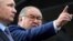 Russian tycoon Alisher Usmanov (right) with Russian President Vladimir Putin (file photo)
