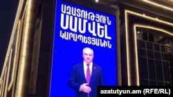 Armenia - A video screen on a shopping mall in Yerevan owned by Samvel Karapetian demands his release from prison, November 29, 2025.