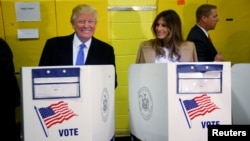 Republican presidential nominee Donald Trump (left) and his wife, Melania, vote in New York City on November 8.