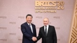 Chinese leader Xi Jinping (left) and Russian President Vladimir Putin meet in Kazan, Russia, for the 2024 BRICS summit. 