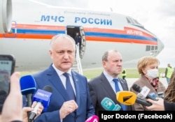 Igor Dodon, Moldova's former pro-Russian president and the leader of the Party of Socialists (PSRM), speaks to reporters after a first batch of Russia's Sputnik V vacccine arrived in Chisinau on April 24.