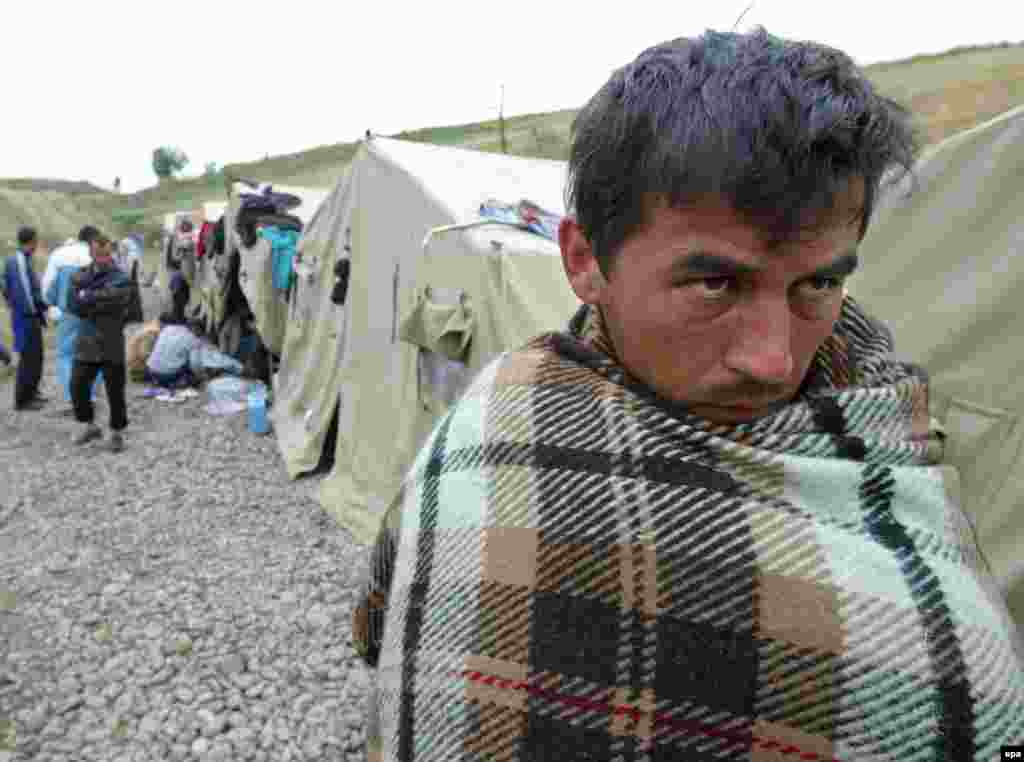 An Uzbek refugee at a camp near the Kyrgyz border village of Barash - Hundreds of Uzbeks fled Andijon for neighboring Kyrgyzstan in the days after the violence. Kyrgyzstan initially closed its border to stop the influx, sparking further protests and unrest. The United Nations High Commissioner for Refugees (UNHCR) eventually granted the fleeing Uzbeks refugee status and helped them relocate to third countries. 