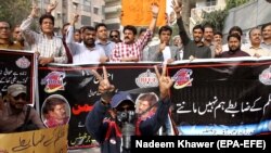 FILE: Pakistani journalists shout slogans during a protest against the alleged killing of a journalist Aziz Memon in the southern city of Hayderabad in February