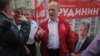 Russian Communist Party leader Gennady Zyuganov (in red) attends campaign event in Moscow on August 26.