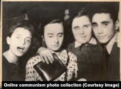 A young Elena Ceausescu (center left) with friends at a ball.