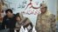 FILE: Pakistani police and and paramilitary forces raid a shop a selling pro-Taliban literature in Quetta, Balochistan.