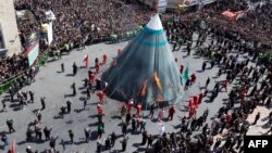 Iranian Shi'ite Muslims burn a tent during the reenactment of the Battle of Karbala, in Tehran, September 10, 2019