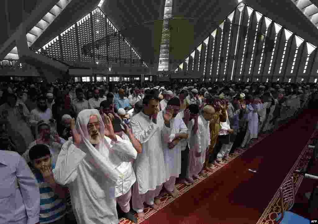 Pakistani Muslims offer first Friday Prayers during the Muslim fasting month of Ramadan at the Grand Faisal Mosque in Islamabad. (AFP/Aamir Qureshi)