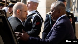 U.S. Defense Secretary Lloyd Austin welcomes Ukrainian Prime Minister Denys Shmyhal to the Pentagon on April 12. 