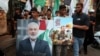 Demonstranți cu portretele lui Haniyeh la un marș al refugiaților palestinieni din Beirut, Liban, la 31 iulie. 